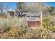 Cottonwood Village sign with brick columns and landscaping at 8915 Federal Blvd # 104, Westminster, CO 80260