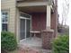 A cozy covered patio with brick accents, perfect for outdoor relaxing at 8915 Federal Blvd # 104, Westminster, CO 80260