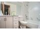 Updated bathroom features a shower-tub combo with tiled surround and a modern vanity at 1211 W 112Th Ave # B, Denver, CO 80234