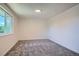 Bedroom with neutral carpet, a window, and white walls at 1211 W 112Th Ave # B, Denver, CO 80234