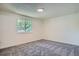 Bedroom featuring neutral carpet, a window, and white walls at 1211 W 112Th Ave # B, Denver, CO 80234