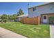 Charming home with a well-manicured lawn and inviting front entrance, featuring stone accents at 1211 W 112Th Ave # B, Denver, CO 80234