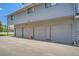 Attached garages, gray in color, with driveway at 1211 W 112Th Ave # B, Denver, CO 80234
