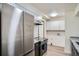 Modern kitchen featuring stainless steel appliances and ample cabinet space at 1211 W 112Th Ave # B, Denver, CO 80234