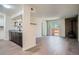 Open concept living space with fireplace, wet bar, and sliding glass doors to the yard at 1211 W 112Th Ave # B, Denver, CO 80234