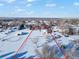 This winter aerial view showcases the property's boundaries at 8530 W Jefferson Ave, Denver, CO 80235