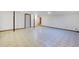 This is an expansive basement with tiled floors, offering a versatile space for recreation or storage at 8530 W Jefferson Ave, Denver, CO 80235