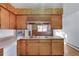 Well-organized kitchen featuring ample counter space and wood cabinetry at 8530 W Jefferson Ave, Denver, CO 80235