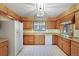 Cozy kitchen with ample cabinet space and classic appliances for a functional cooking area at 8530 W Jefferson Ave, Denver, CO 80235