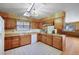 Classic kitchen featuring ample counter space and wood cabinetry at 8530 W Jefferson Ave, Denver, CO 80235