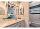 Bright bathroom with vanity and mirror and open access to bathtub/shower at 5750 W Atlantic Pl, Lakewood, CO 80227