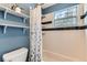 Full bath featuring black and white tile, tub, and window at 5750 W Atlantic Pl, Lakewood, CO 80227