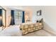 Cozy bedroom featuring plush carpeting, natural light and a spacious closet at 5750 W Atlantic Pl, Lakewood, CO 80227