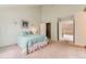 Bright bedroom featuring carpet and entry to closet at 5750 W Atlantic Pl, Lakewood, CO 80227