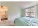 Bright bedroom with carpet and doorway to bathroom at 5750 W Atlantic Pl, Lakewood, CO 80227