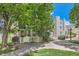 Charming home featuring mature trees, a walkway, and a well-maintained front yard at 5750 W Atlantic Pl, Lakewood, CO 80227
