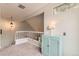 Light and airy hallway with view to lower level and cabinet with accent lighting at 5750 W Atlantic Pl, Lakewood, CO 80227