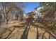 View of a spacious backyard featuring a lawn with a patio and a deck at 6251 S Iola Ct, Englewood, CO 80111