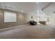 Spacious finished basement with a pool table, comfortable chair, and neutral carpet at 6251 S Iola Ct, Englewood, CO 80111