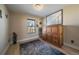 Bedroom with hardwood floors, and a murphy bed with a wooden cabinet and neutral decor at 6251 S Iola Ct, Englewood, CO 80111