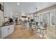 Bright kitchen featuring stainless steel appliances, a center island, and a cozy breakfast nook with a bay window at 6251 S Iola Ct, Englewood, CO 80111