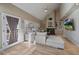 Inviting living room with vaulted ceilings, a fireplace, built-in shelving, and a comfortable sectional sofa at 6251 S Iola Ct, Englewood, CO 80111