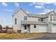 Charming townhome with vinyl siding, attached garage, and well-maintained landscaping at 12635 E Pacific Cir # A, Aurora, CO 80014