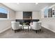 Cozy finished basement with a fireplace, carpeted floors, and natural light at 15875 E Custer Dr, Aurora, CO 80017
