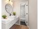 Stylish bathroom with modern vanity, sleek fixtures, and tub at 15875 E Custer Dr, Aurora, CO 80017
