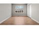 Bright, empty bedroom with neutral walls, wood floors, and a closet at 15875 E Custer Dr, Aurora, CO 80017