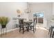 Dining area featuring a chandelier and sliding door access to the backyard at 15875 E Custer Dr, Aurora, CO 80017