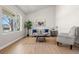 Bright living room with vaulted ceilings, a large window, and neutral decor at 15875 E Custer Dr, Aurora, CO 80017