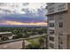 Sunset view from balcony, showing city and mountain views at 5455 Landmark Pl # 1009, Greenwood Village, CO 80111