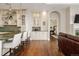 View of the kitchen with bar seating flowing into the open living area at 5455 Landmark Pl # 1009, Greenwood Village, CO 80111