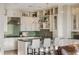 An open kitchen design with modern appliances, ample cabinetry, and stylish lighting fixtures at 5455 Landmark Pl # 1009, Greenwood Village, CO 80111