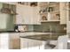 A close up of the kitchen featuring granite counters and tile backsplash at 5455 Landmark Pl # 1009, Greenwood Village, CO 80111