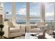 Cozy sitting area with chairs, large windows and beautiful views of mountains and sky at 5455 Landmark Pl # 1009, Greenwood Village, CO 80111