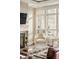 Bright sitting area with fireplace, and large windows with neighborhood view at 5455 Landmark Pl # 1009, Greenwood Village, CO 80111