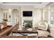Bright living room featuring a fireplace, large windows and open floor plan at 5455 Landmark Pl # 1009, Greenwood Village, CO 80111