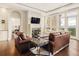 Living room featuring a fireplace, stylish seating, and scenic views from large windows at 5455 Landmark Pl # 1009, Greenwood Village, CO 80111