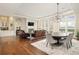 Spacious open concept living area featuring modern decor, fireplace, and large windows with mountain views at 5455 Landmark Pl # 1009, Greenwood Village, CO 80111