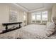Bright main bedroom with a view, a console table, and a sitting area at 5455 Landmark Pl # 1009, Greenwood Village, CO 80111