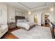 This main bedroom has an ensuite bathroom, a closet, and beautiful wood floors at 5455 Landmark Pl # 1009, Greenwood Village, CO 80111