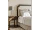 Comfortable bedroom with stylish lamp near the bedside table and plush pillows at 5455 Landmark Pl # 1009, Greenwood Village, CO 80111