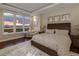 Bright main bedroom with a view, stylish decor and a sitting area at 5455 Landmark Pl # 1009, Greenwood Village, CO 80111
