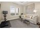 Comfortable sitting room with a TV, couch, bench seats, carpet and a great view at 5455 Landmark Pl # 1009, Greenwood Village, CO 80111