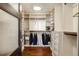 Spacious walk-in closet with custom shelving and organizational features at 5455 Landmark Pl # 1009, Greenwood Village, CO 80111
