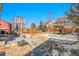 Outdoor patio area with seating, a play set, and a basketball hoop, great for entertainment and recreation at 3644 Sunchase Dr, Castle Rock, CO 80109