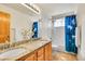 Well-lit bathroom featuring double sinks with granite countertops, tiled floors, and a shower with tub combination at 3644 Sunchase Dr, Castle Rock, CO 80109