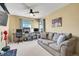 Comfortable bedroom featuring a ceiling fan and a spacious sofa, plus desks, making it ideal for work or leisure at 3644 Sunchase Dr, Castle Rock, CO 80109